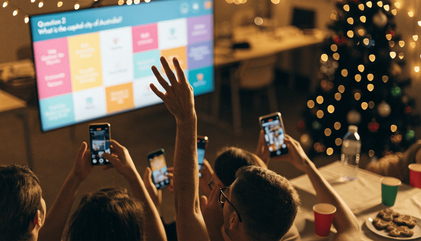 Colleagues at an office Christmas party holding up phones to play a quiz game on a big screen